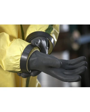 Person wearing protective gloves and yellow hazmat suit.