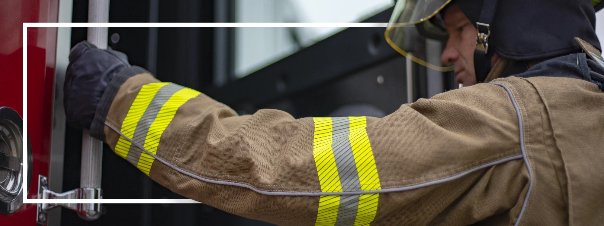 Firefighter demonstrating the contoured design and mobility of Lakeland's fire gear