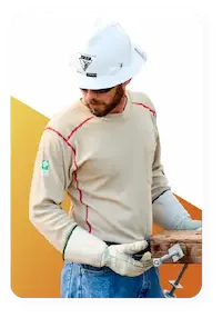 Lineman working in highly dangerous environment, wearing Lakeland Industries high performance FR clothing to keep protected