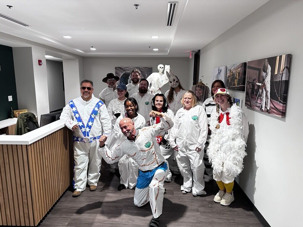 Group in costumes having fun indoors.