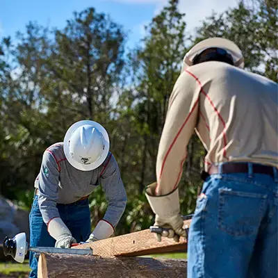 utility-workers-fixing-utility-pole-wearing-lakeland-hpfr-400x400-xd